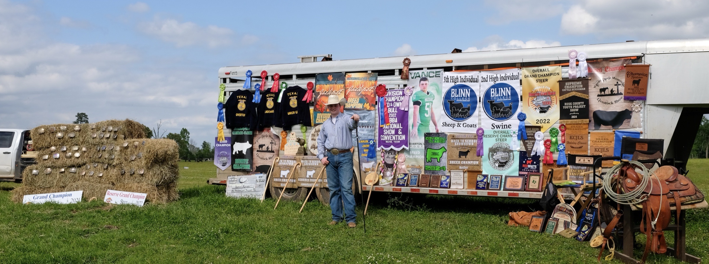 Vance Aaron with livestock championship banners and awards
